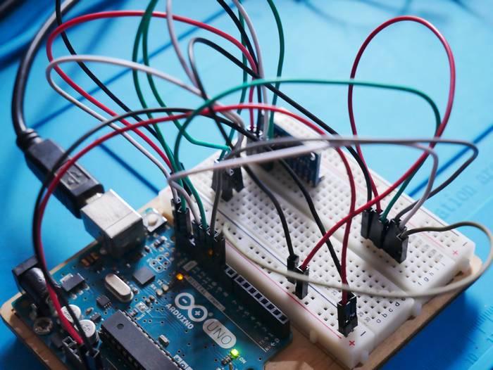 Arduino Uno connected to a breadboard sensor circuit via jumper wires