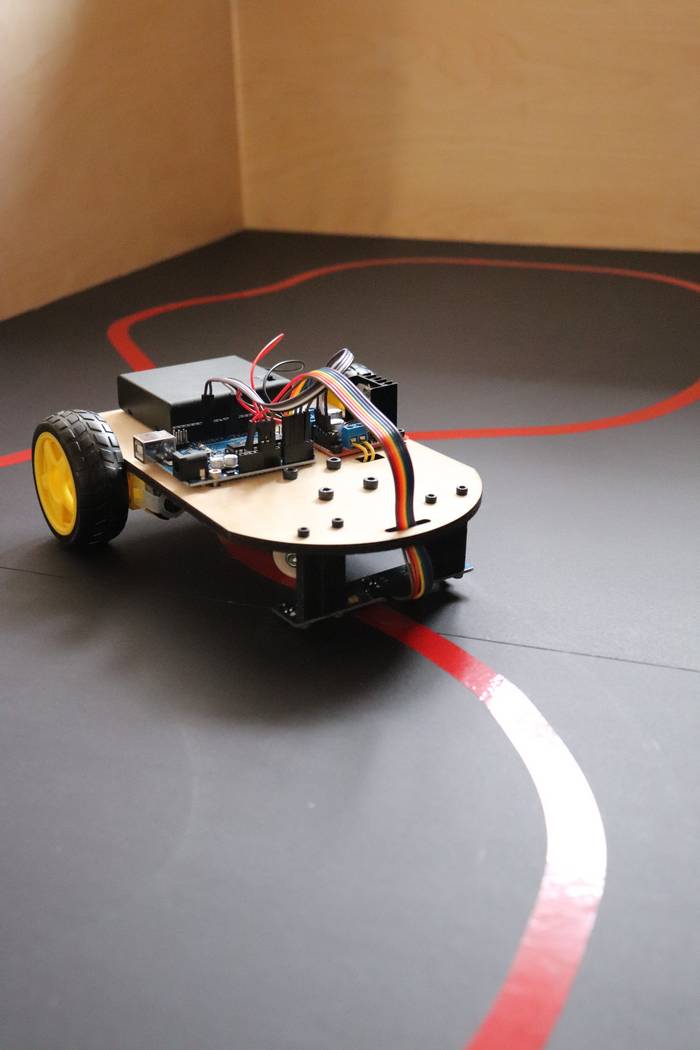 Line following robot driving autonomously around a race track loop